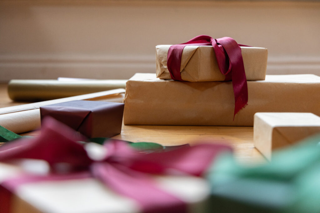 Gifts wrapped in brown kraft paper with ribbon